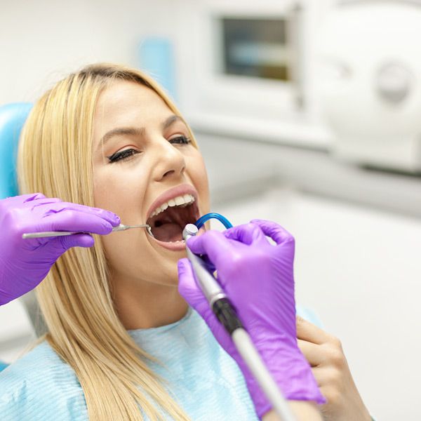 Woman with receiving dental care